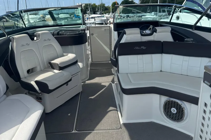Slide: The Image of Interior of 2016 Sea Ray 350 SLX boat with white seating and modern design. - 5
