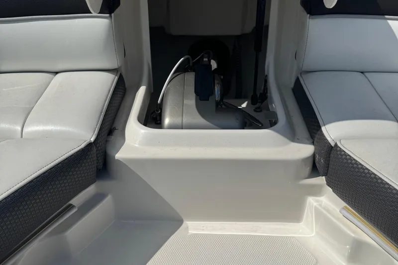 Slide: The Image of Interior seating of 2016 Sea Ray 350 SLX boat, featuring white and black upholstery. - 7
