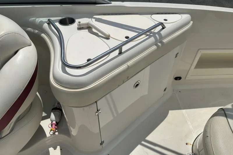 Slide: The Image of 2007 Monterey 263 Explorer Deck Boat interior with seating and storage area. - 13