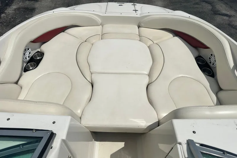 Slide: The Image of 2007 Monterey 263 Explorer Deck Boat with spacious white seating and cup holders. - 14