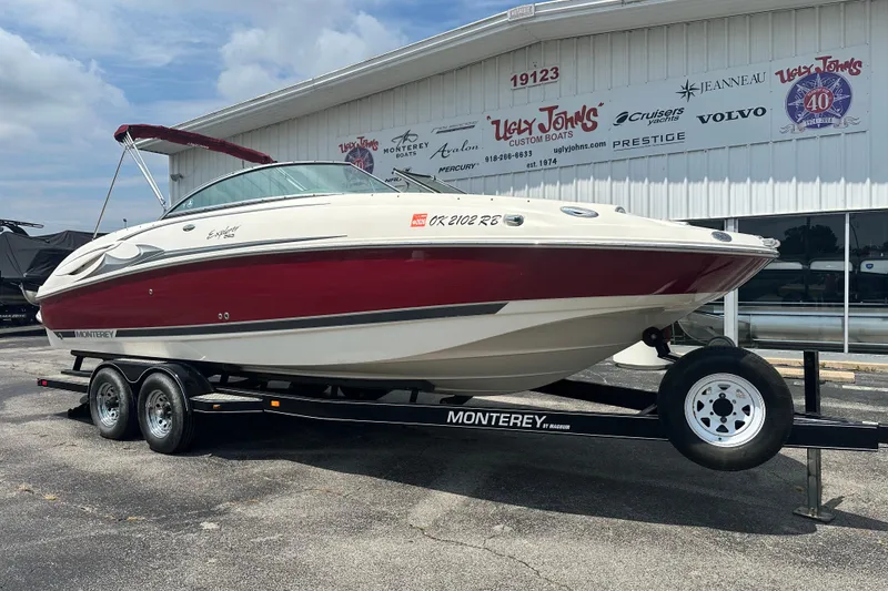 Slide: The Image of 2007 Monterey 263 Explorer Deck Boat on trailer outside dealership. - 4