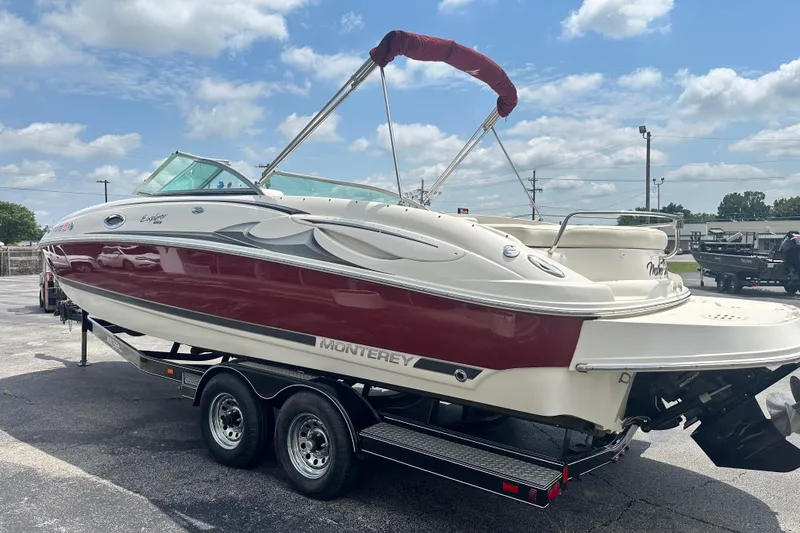 Slide: The Image of 2007 Monterey 263 Explorer Deck Boat on trailer under blue sky. - 7