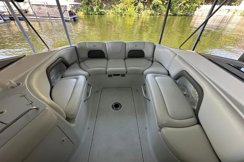 Slide: The Image of 2005 Crownline 270 BR boat interior with spacious seating and cup holders. - 13