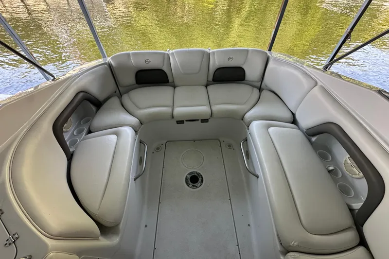 Slide: The Image of 2005 Crownline 270 BR boat interior with spacious seating and cup holders. - 14