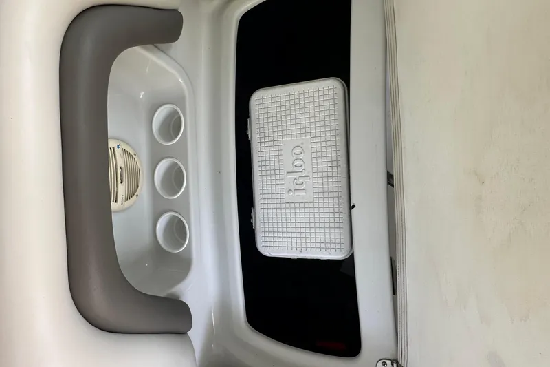Slide: The Image of 2005 Crownline 270 BR boat interior with Igloo cooler and cup holders. - 28