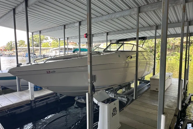 Slide: The Image of 2005 Crownline 270 BR boat docked in a covered marina slip. - 3