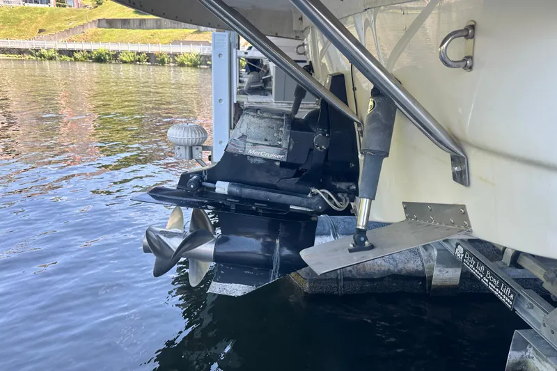 Slide: The Image of 2005 Crownline 270 BR boat with MerCruiser outdrive in water at dock. - 32