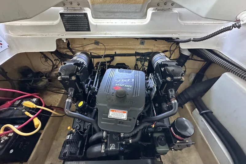 Slide: The Image of Engine compartment of a 2005 Crownline 270 BR boat, featuring a MerCruiser 350 MAG MPI engine. - 34