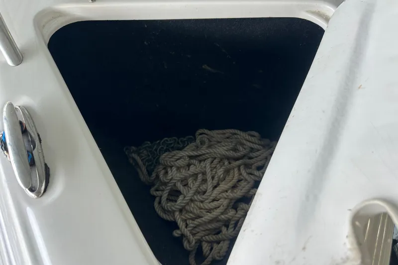Slide: The Image of Storage compartment with rope on a 2005 Crownline 270 BR boat. - 41