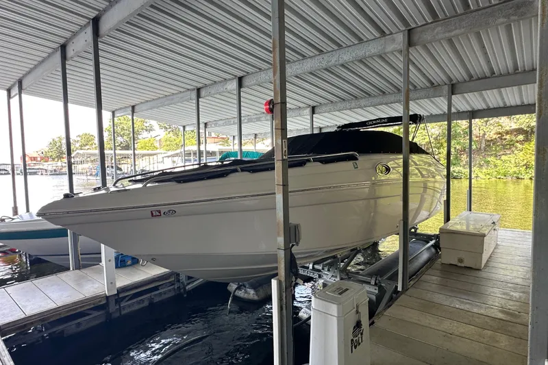 Slide: The Image of 2005 Crownline 270 BR boat docked in covered marina slip. - 7