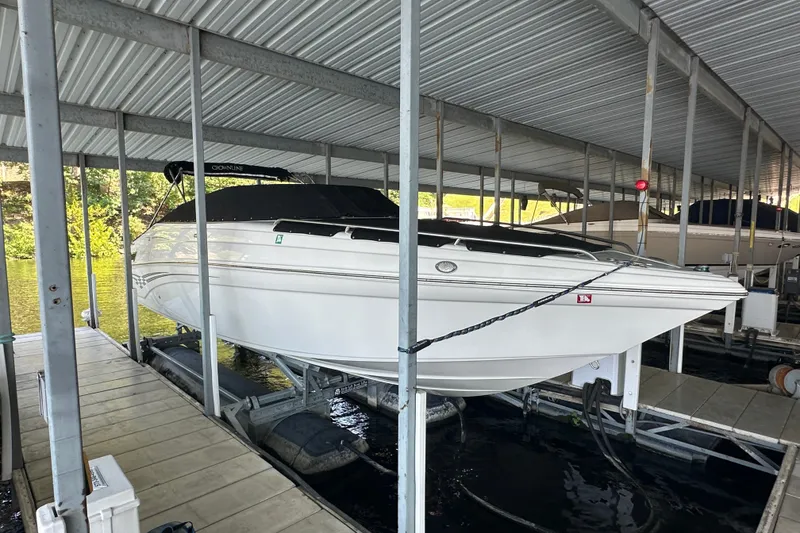 Slide: The Image of 2005 Crownline 270 BR boat docked in covered marina slip. - 8