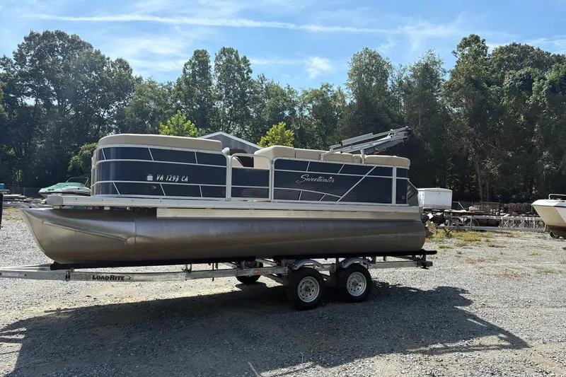 Slide: The Image of 2016 Godfrey SWEETWATER 2086 pontoon boat on trailer, parked outdoors. - 3