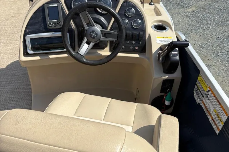 Slide: The Image of 2016 Godfrey SWEETWATER 2086 boat dashboard with steering wheel and controls. - 5