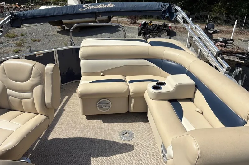 Slide: The Image of 2016 Godfrey SWEETWATER 2086 pontoon boat interior with beige seating and cup holders. - 7