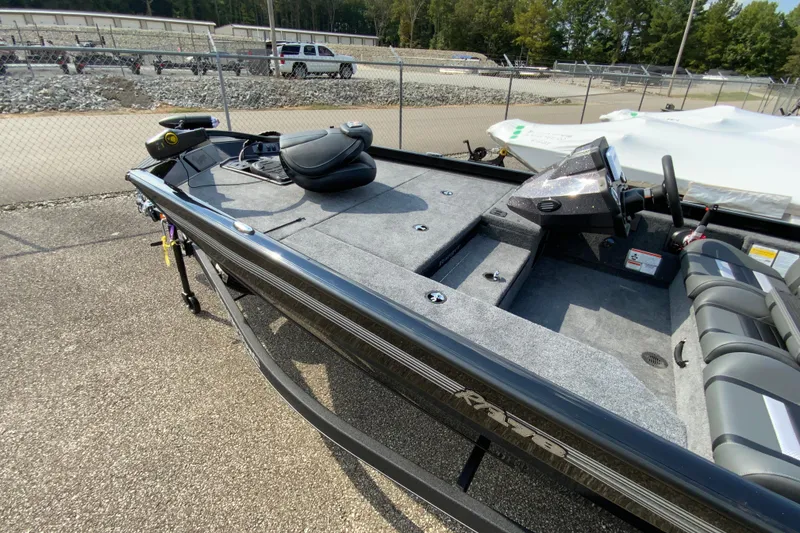 Slide: The Image of 2026 Ranger RT178 boat with spacious deck and seating, parked outdoors. - 10