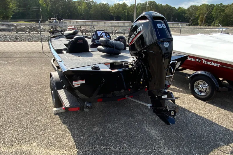 Slide: The Image of 2026 Ranger RT178 boat with Mercury 60 engine, parked outdoors. - 5