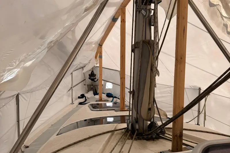 Slide: The Image of Interior view of a 1997 Hunter 340 sailboat under protective cover. - 8