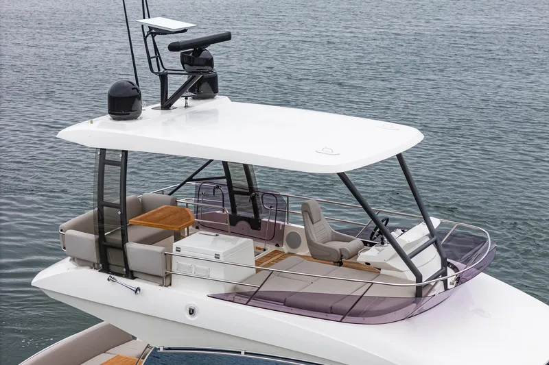 Slide: The Image of 2021 Prestige 420 Fly yacht with flybridge, sleek design, and modern amenities on water. - 17