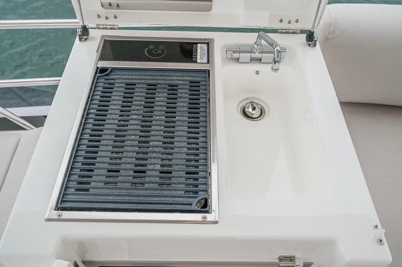 Slide: The Image of Outdoor grill and sink on 2021 Prestige 420 Fly yacht deck. - 24