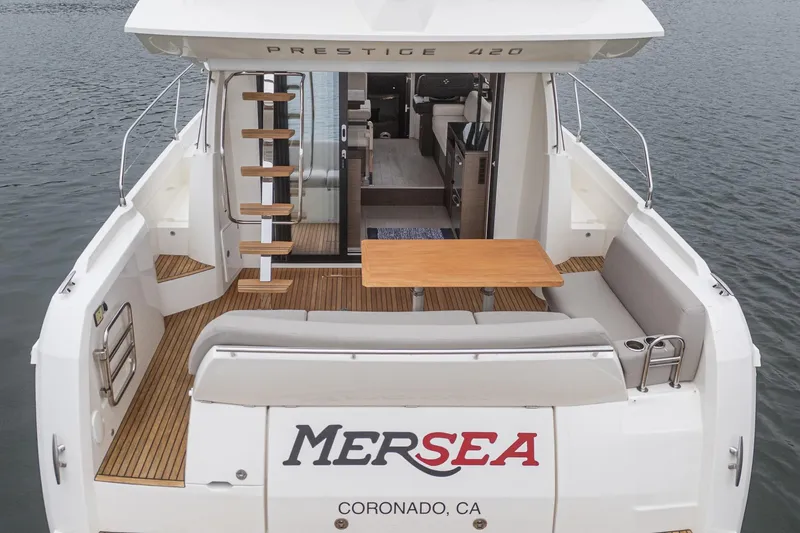 Slide: The Image of 2021 Prestige 420 Fly yacht with spacious deck and seating area, docked in Coronado, CA. - 28
