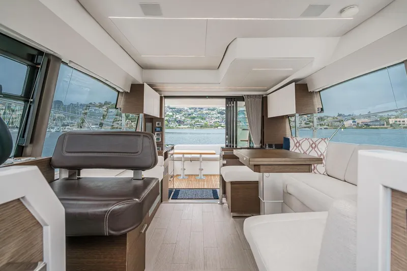 Slide: The Image of Luxurious interior of 2021 Prestige 420 Fly yacht with panoramic windows and elegant seating. - 35