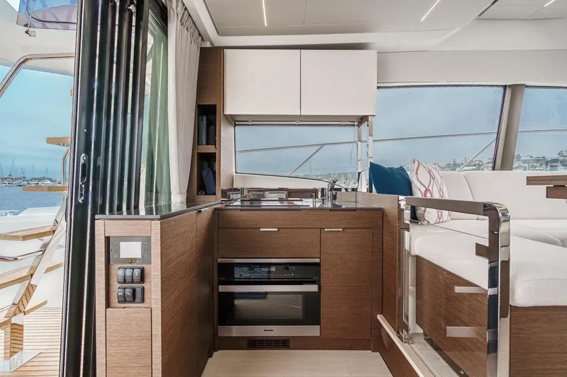 Slide: The Image of Luxurious interior of 2021 Prestige 420 Fly yacht with modern kitchen and seating area. - 40