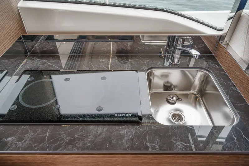 Slide: The Image of Modern kitchen area on 2021 Prestige 420 Fly yacht with stove and sink. - 42