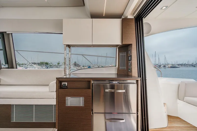Slide: The Image of Luxurious interior of 2021 Prestige 420 Fly yacht with modern kitchen and marina view. - 44