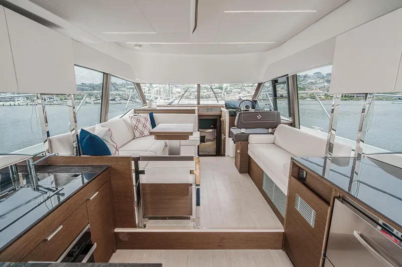 Slide: The Image of Luxurious interior of 2021 Prestige 420 Fly yacht with modern furnishings and panoramic windows. - 46