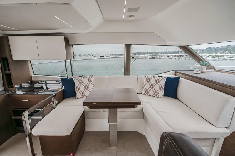 Slide: The Image of Luxurious interior of 2021 Prestige 420 Fly yacht with elegant seating and scenic views. - 47