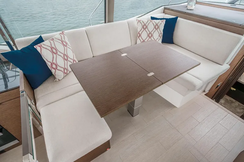 Slide: The Image of Luxurious seating area on 2021 Prestige 420 Fly yacht with elegant cushions and table. - 49