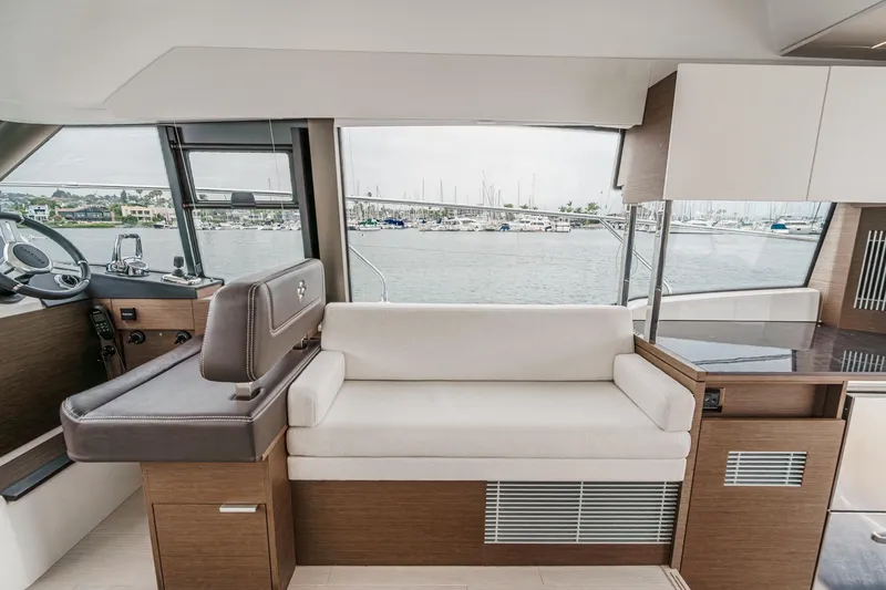 Slide: The Image of Interior of 2021 Prestige 420 Fly yacht with modern seating and helm station. - 50
