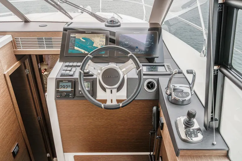Slide: The Image of Cockpit of 2021 Prestige 420 Fly yacht with modern navigation controls and displays. - 53