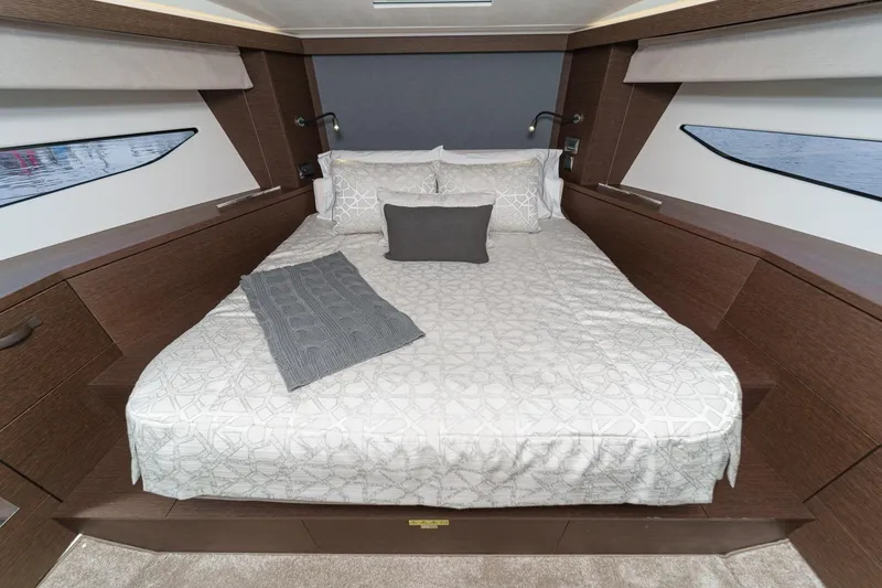 Slide: The Image of Luxurious bedroom interior of 2021 Prestige 420 Fly yacht with elegant bedding. - 59
