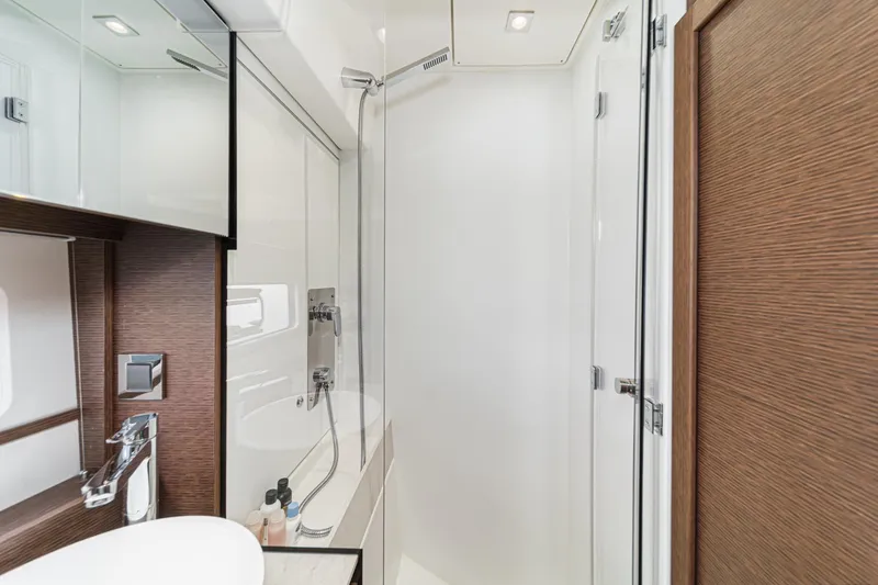 Slide: The Image of Luxurious bathroom in 2021 Prestige 420 Fly yacht with modern fixtures and elegant design. - 67