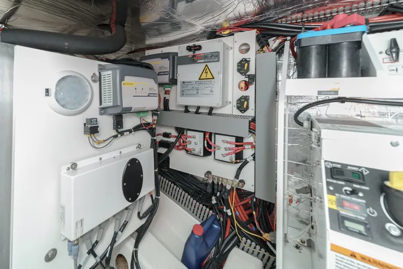 Slide: The Image of Electrical system of a 2021 Prestige 420 Fly yacht, showcasing wiring and control panels. - 72