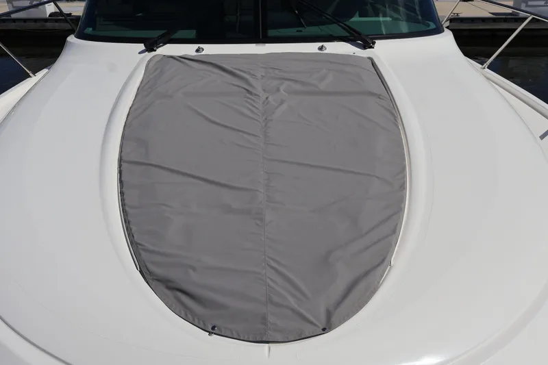 Slide: The Image of 2020 Tiara Yachts C44 Coupe with covered sunpad on deck. - 28