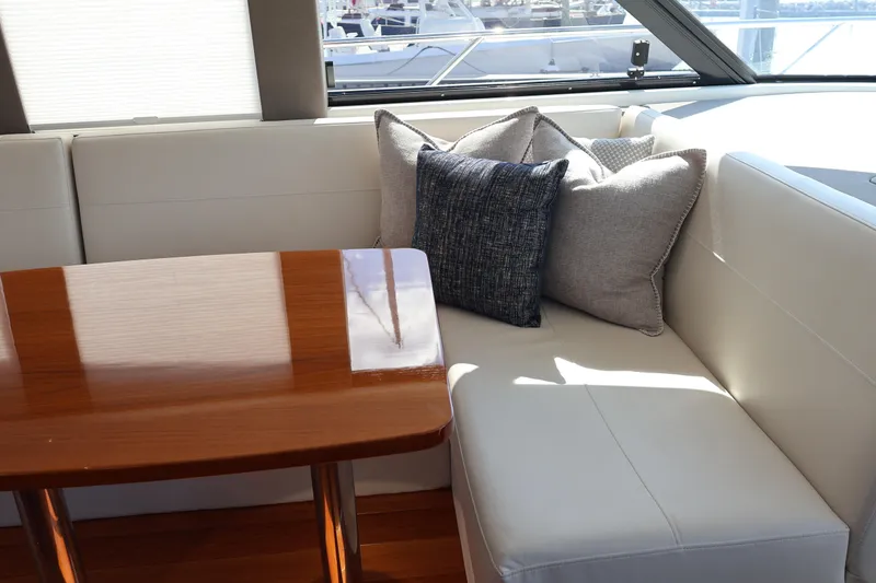 Slide: The Image of Luxurious interior of 2020 Tiara Yachts C44 Coupe with elegant seating and cushions. - 33