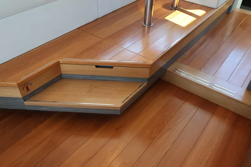 Slide: The Image of 2020 Tiara Yachts C44 Coupe interior with elegant wooden flooring and steps. - 35