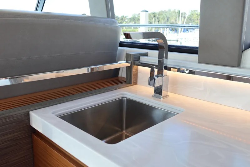 Slide: The Image of Modern kitchen sink area in 2020 Tiara Yachts C44 Coupe. - 37