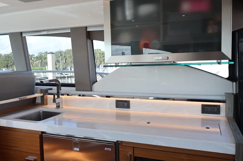 Slide: The Image of Modern kitchen interior of 2020 Tiara Yachts C44 Coupe with sleek countertops and appliances. - 38