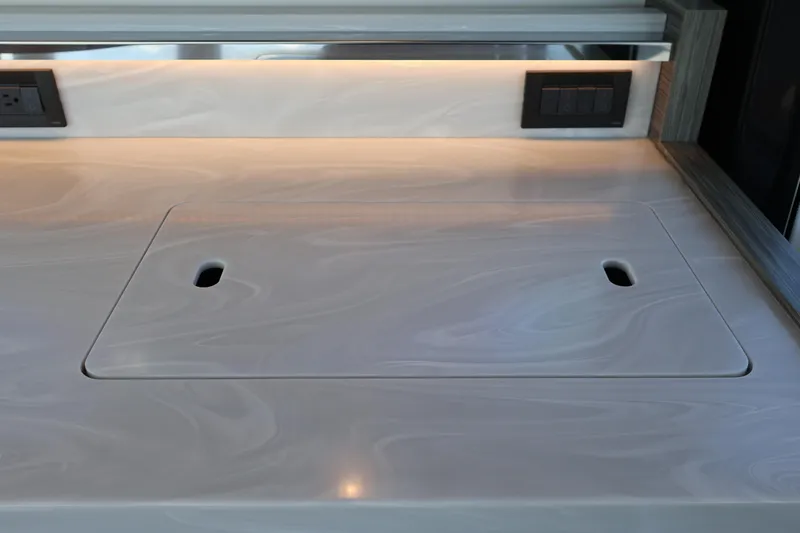 Slide: The Image of Modern kitchen countertop on 2020 Tiara Yachts C44 Coupe with integrated outlets. - 45