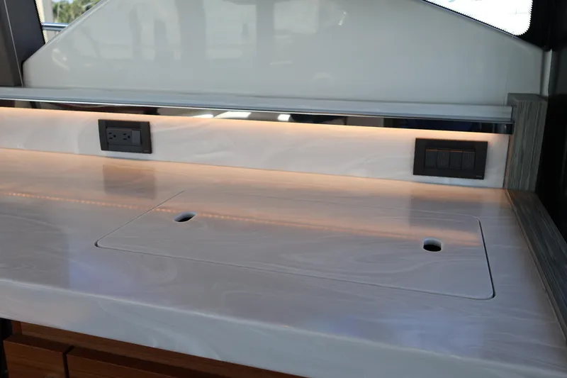 Slide: The Image of Modern kitchen counter with outlets on 2020 Tiara Yachts C44 Coupe. - 47
