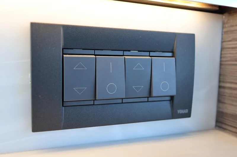 Slide: The Image of Control panel on 2020 Tiara Yachts C44 Coupe, featuring modern switches. - 50