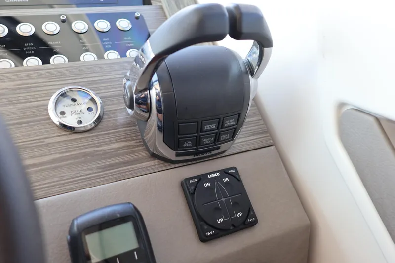 Slide: The Image of Control panel of 2020 Tiara Yachts C44 Coupe with throttle and trim tabs. - 66