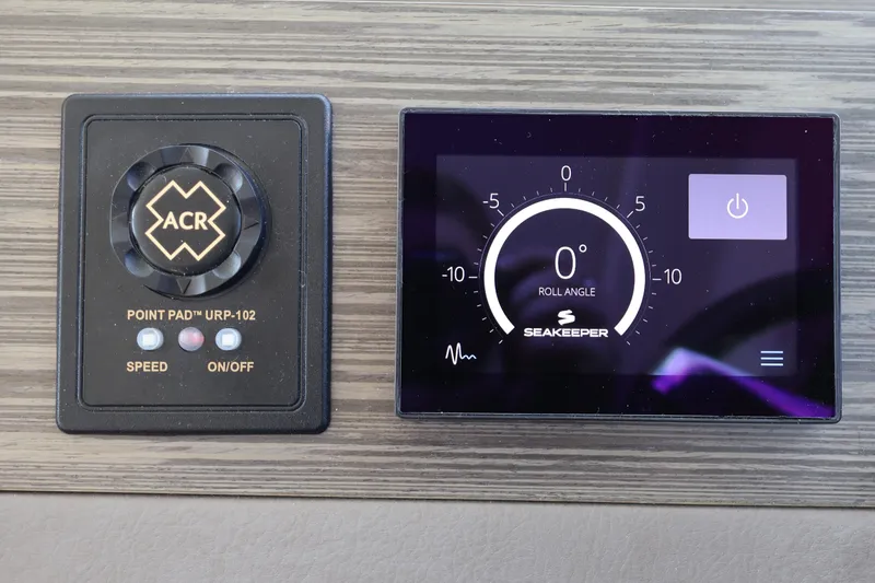 Slide: The Image of Control panel of a 2020 Tiara Yachts C44 Coupe featuring ACR and Seakeeper displays. - 67