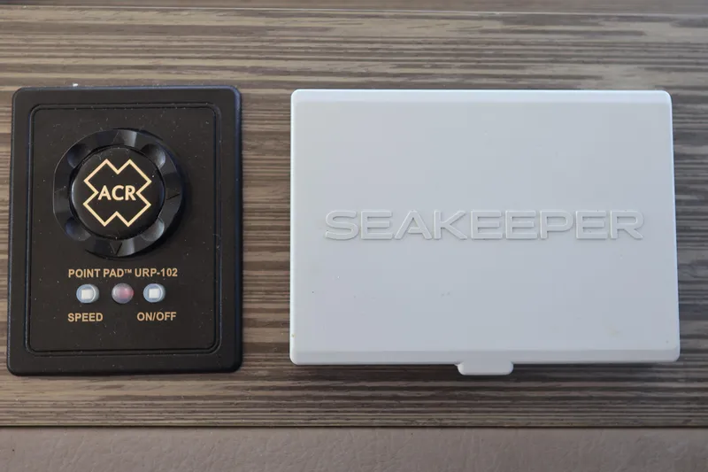 Slide: The Image of Control panel and Seakeeper unit on 2020 Tiara Yachts C44 Coupe. - 68