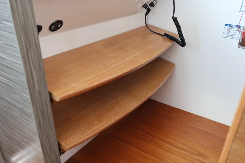 Slide: The Image of Wooden interior shelves in a 2020 Tiara Yachts C44 Coupe. - 70