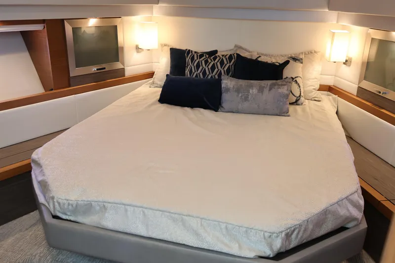 Slide: The Image of Luxurious bedroom interior of 2020 Tiara Yachts C44 Coupe with elegant bedding and lighting. - 73