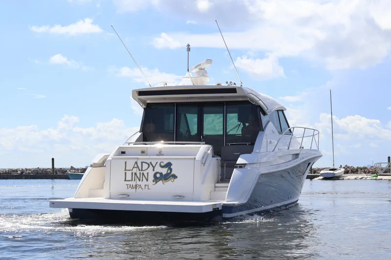 Slide: The Image of 2020 Tiara Yachts C44 Coupe, "Lady Linn," cruising in Tampa, FL waters. - 8